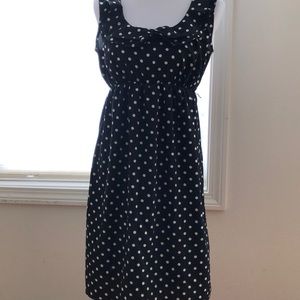 Maternity dress in black and white polka dots.